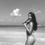 Bikini girl walking on the beach for photoshoots