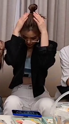 ITZY Ryujin is worried about her top.