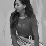 TWICE NAYEON's heart on her chest.