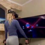 A woman who plays VR games.