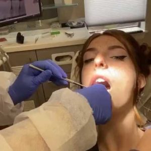 A dentist who slaps a patient in the face.