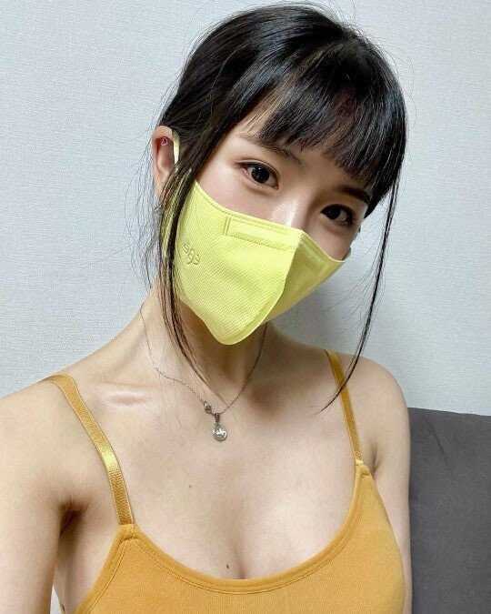 Cho Hyun-young with a yellow mask.