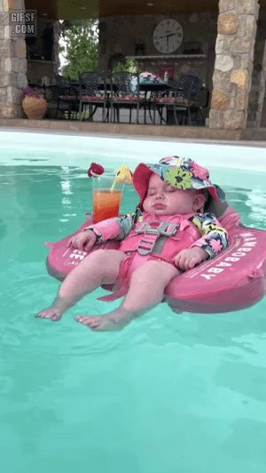 A baby asleep in the pool.gif