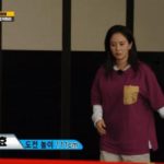 Song Jihyo jumps high and the purple t-shirt is fluttering.