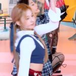 SANA's red checkered skirt.