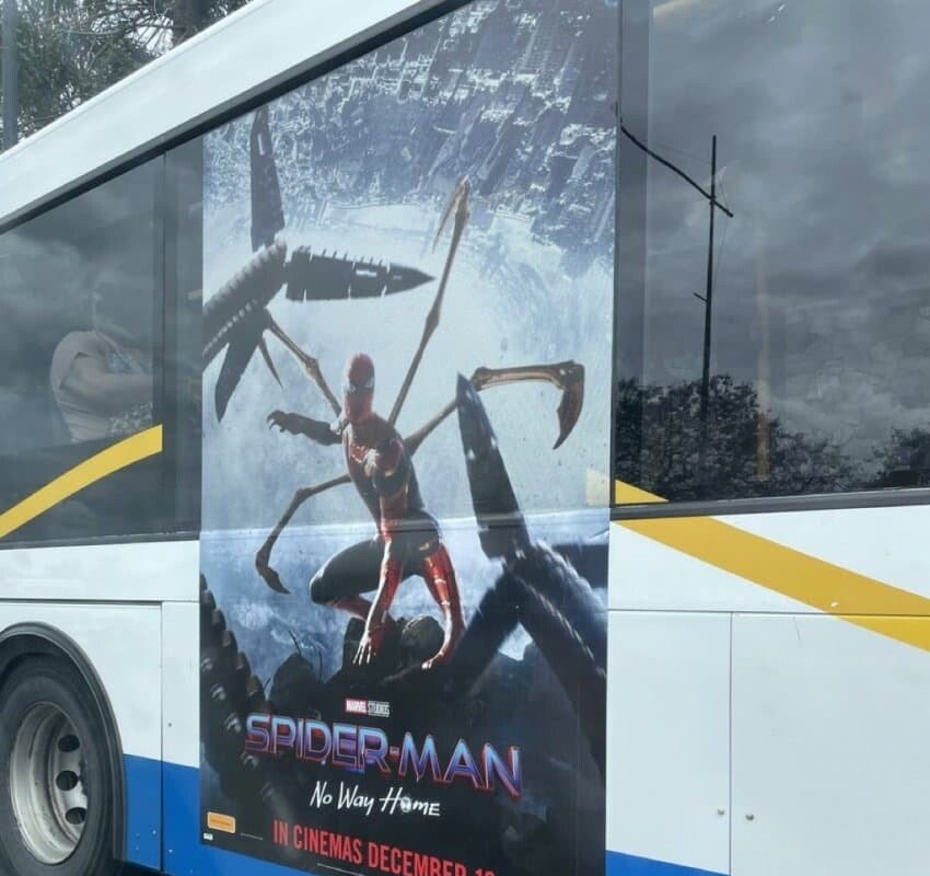 Let's promote Spider-Man. Posters are on the bus.