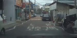 Colliding with a bicycle at a mini intersection gif
