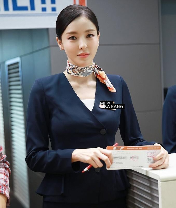 Lee Dahee in a flight attendant uniform.