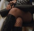 Sejeong crossed her legs in a mesh.