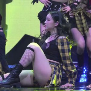 Billie Suhyun sitting on the floor.