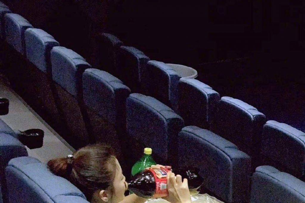 An outsider who watches a movie alone.jpg