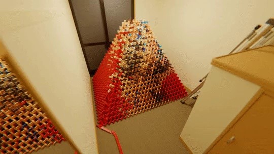 10,000-piece pyramid dominoes completed by collapsing