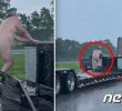 A picture of me riding a motorway trailer naked