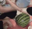 It's a new concept. A woman's watermelon breaking gif