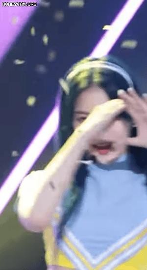 During the ending of a girl group's music show, the paper on the eyelashes