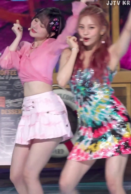 See-through pink cropped short skirt. Bibi and Eunha