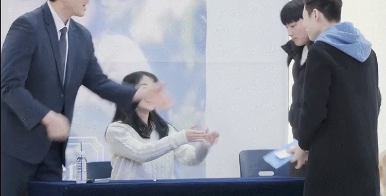 IU is begging for a handshake from a fan
