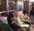 (SOUND)An old man who hits a woman's leg with a newspaper for crossing her leg on a Japanese subway.