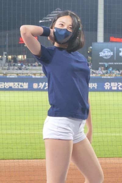 Kim Yuna, cheerleader T-shirt and white shorts.