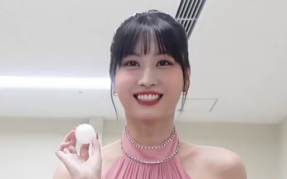 TWICE MOMO playing with heavy pink halter neck dress throwing