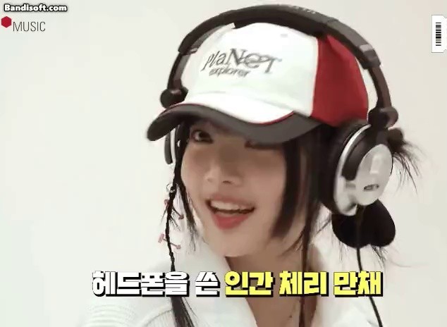 A human cherry with headphones on