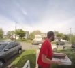 Pizza delivery man who knocks down a fugitive chased by police