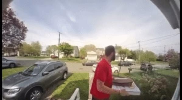 Pizza delivery man who knocks down a fugitive chased by police