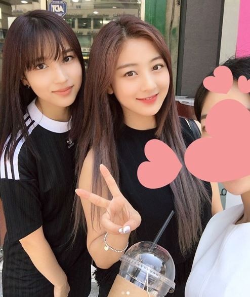 A photo of Mina and Jihyo on Garosu-gil