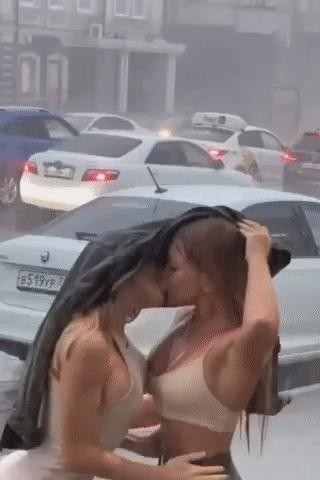 Couple kissing in the rain gif