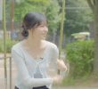 JO YU RI sitting on the swing wearing a gray super mini and smooth thigh