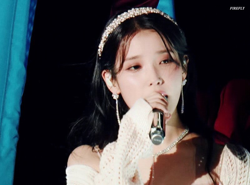 Princess IU holding the microphone