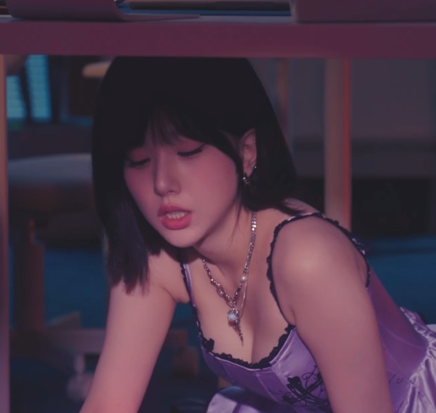 Bibi Ji Eunha's breast bone, lying face down in a purple lingerie look under her desk