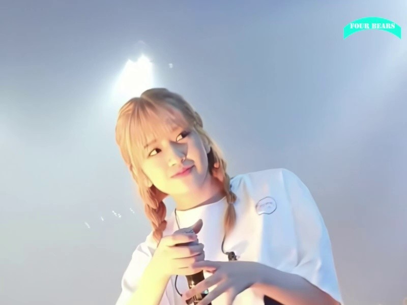 Ahn Yujin's pigtails sitting calmly on the stage