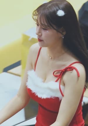 Kim Do-ah's cheerleader's chest bone from above Santa's uniform