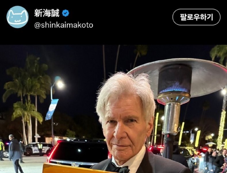 Harrison Ford holding a chair