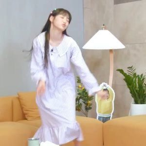 Chuu in pure white who really let her guard down under her pajamas while standing up