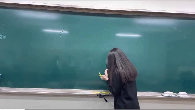 a high school student drawing a circle