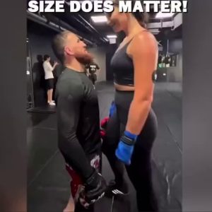 (SOUND)sparring between a short man and a tall woman