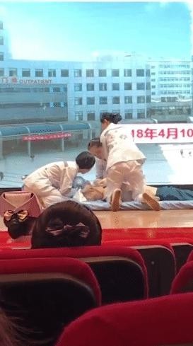 h. Cardiopulmonary resuscitation demonstration by a Chinese female nurse
