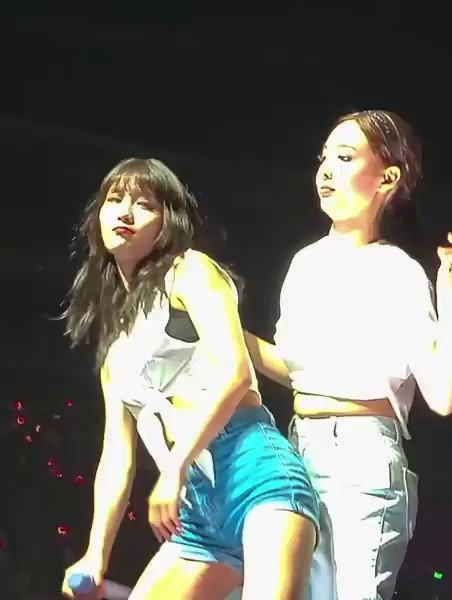 From the bottom, TWICE SANA and MOMO on the back of the blue pants