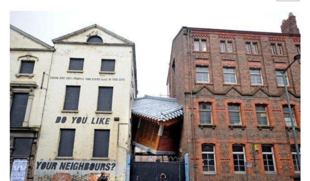 Hanok sandwiched between Liverpool buildings
