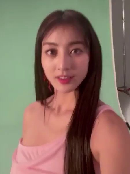 Twice Jihyo getting makeup, cleavage taken on top of a silver string dress
