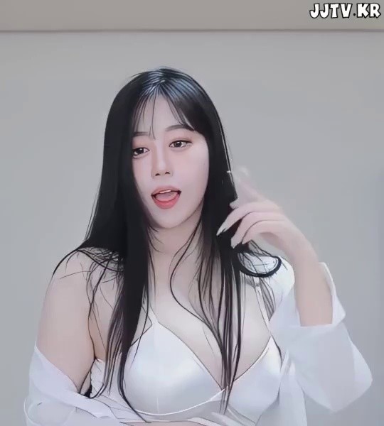 BJ Yeri takes off her shirt and shows off her white bra and cleavage