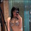 Go Mal-sook takes a leopard print bikini mirror selfie in the bathroom