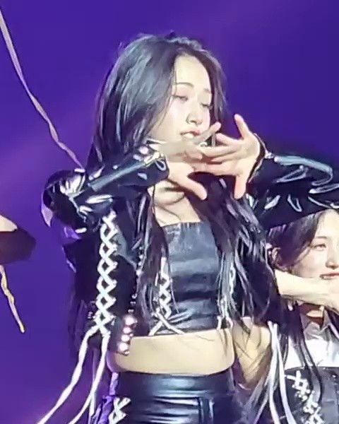 Ive An Yu-jin's firm thighs caressing her breasts in a leather strap tube top