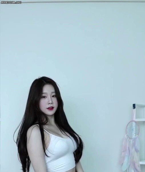 Hangeung, who doesn't seem to be good at dancing, has a white tank top and cleavage