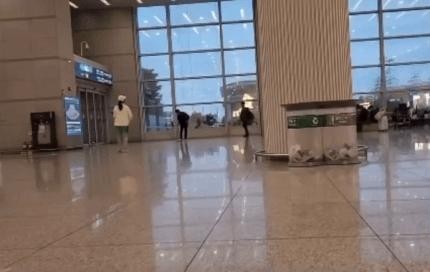 Couple playing tennis at the entrance of Incheon Airport