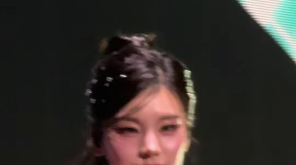 Ponytail taken slightly from below ITZY Yeji's crop top with a flowing bounce